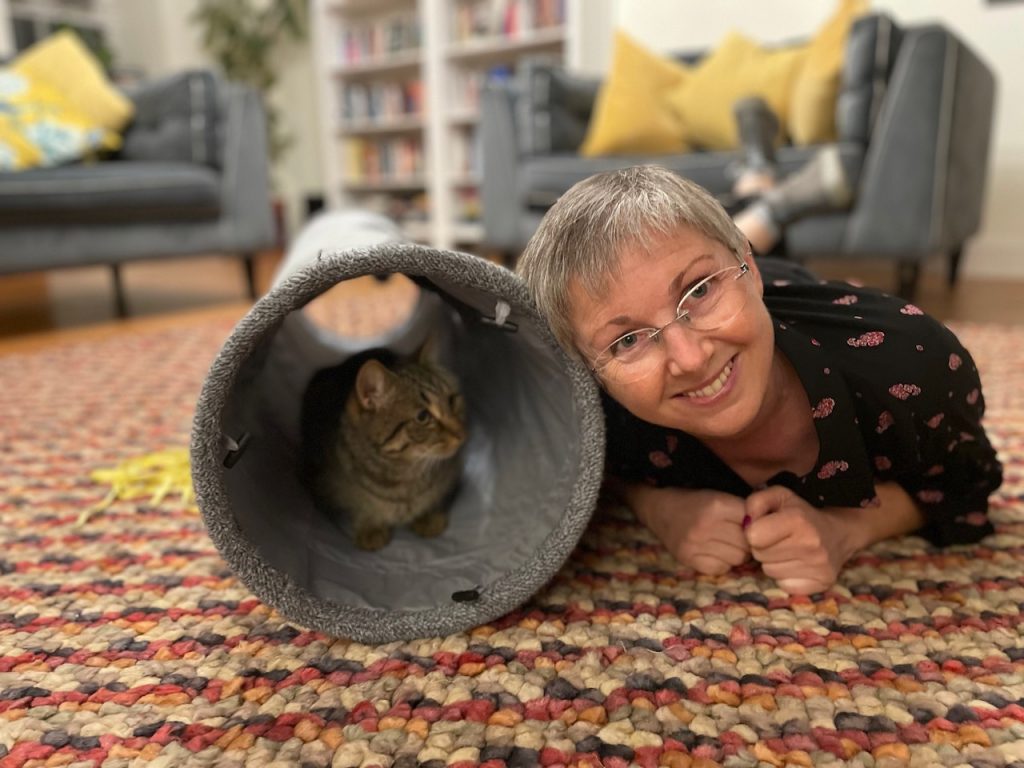 Minnie and one of her many cat friends Mia with one of her cat sitting customers